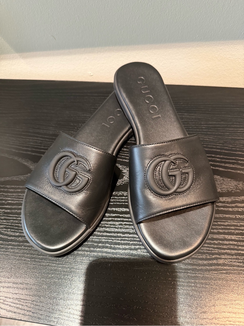 Authentic Gucci Black Leather GG Embossed Slide Sandals. Worn once